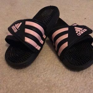 Pink and black adidas slides